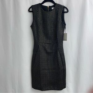 Mini dress Calvin Klein, size 2, black with gold decoration.